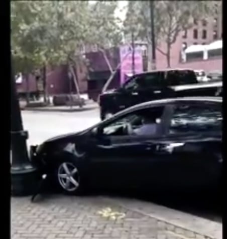 man crashes car into lightpole